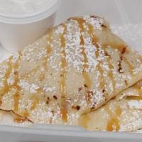 Carmel Apple Cinnamon Crepe · Carmel with cinnamon apples on a crepe