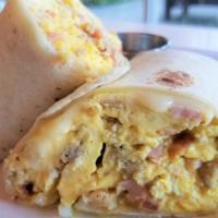 Meat Lovers Burrito · Scrambled Eggs, Ham, Bacon, Italian Sausage, Mozzarella Cheese and Hash Browns wrapped in a ...