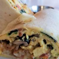 Vegetarian  Burrito · Scrambled Eggs, Onion, Tomato, Spinach, Mushroom and Hash browns wrapped in a flour tortilla.