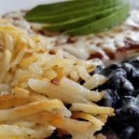 Huevos Rancheros · Two eggs, corn tortillas, black beans, Mozzarella cheese, fresh ranchero sauce. Served with ...