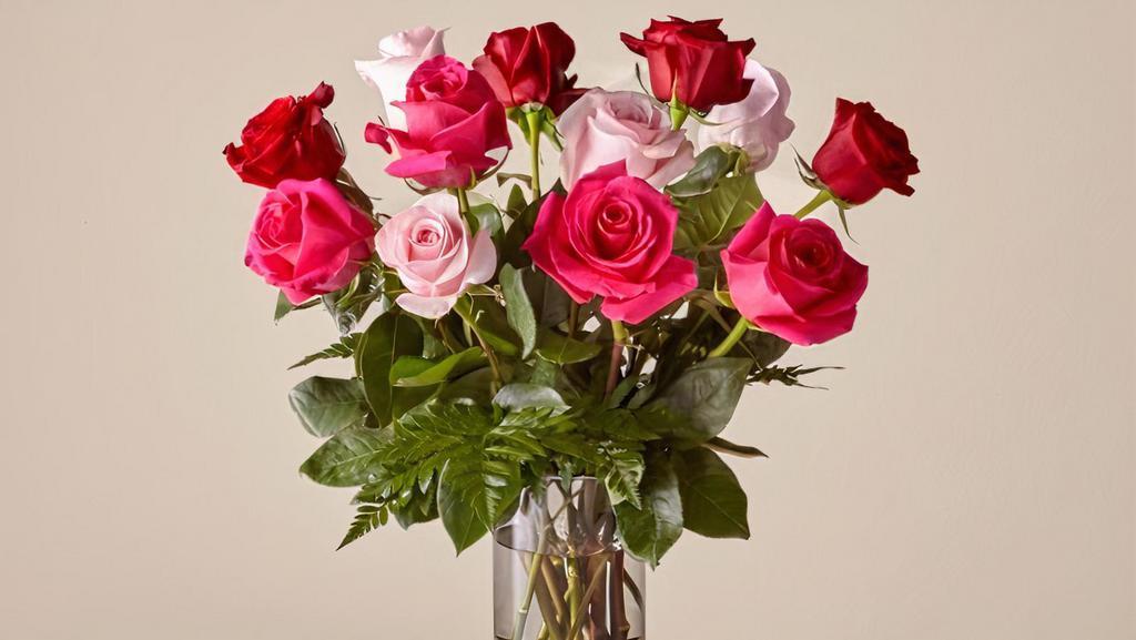 Rose Colored Love · This elegant, sophisticated bouquet combines classic Valentine's Day roses with a pop of color. Three colors (red, pink & hot pink) of roses will add a little color and romance to your life.