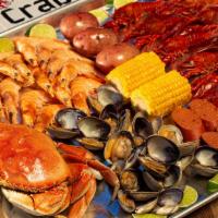 C4. One Dungeness Crab Combo with 1 Lb. Shrimp · Includes 1 lb. Clams, 1 lb. Craw-fish, 2 corns, 2 potatoes and 4 sausages slices. Shrimp ser...
