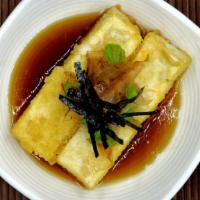 Agedashi Tofu  · Deep-fried tofu top with green onion and dried bonito flakes.