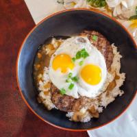 Loco Moco (Mini) · Hamburger patties over rice covered with brown gravy and topped with eggs.