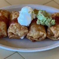 Mini Chimichangas · Flour tortillas filled with beans, chicken or shredded beef, cheese, rolled and deep fried. ...