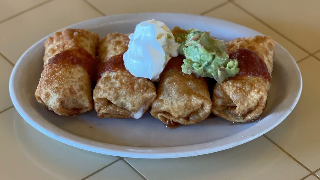 Mini Chimichangas · Flour tortillas filled with beans, chicken or shredded beef, cheese, rolled and deep fried. Topped with sour cream, sauce and guacamole.