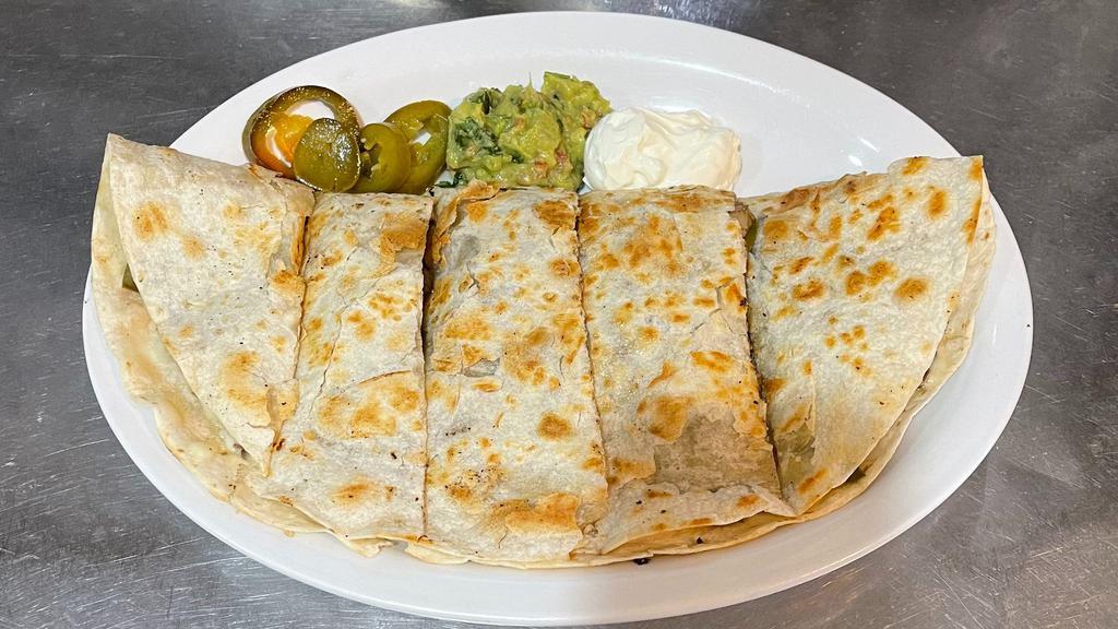 Quesadilla Deluxe · Our tortilla layered with cheese, mushrooms and onions. Grilled and topped with sour cream, guacamole and jalapeños.