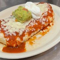 Super Burrito · A large flour tortilla filled with your choice of meat, beans and rice. Topped with sauce, c...