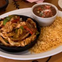 Fajitas · Your choice of meat marinated and sautéed with onions, bell peppers and tomatoes. Served wit...