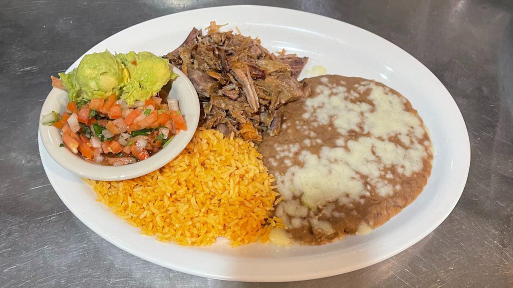Carnitas · Gluten-Free. Tender marinated fried pork, served with guacamole, pico de gallo, rice, beans and tortillas.