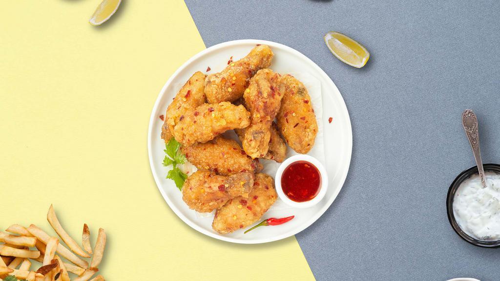 Red Buffed Chicken Wings · Chicken wings a our own tangy sweet a spicy sauce.
