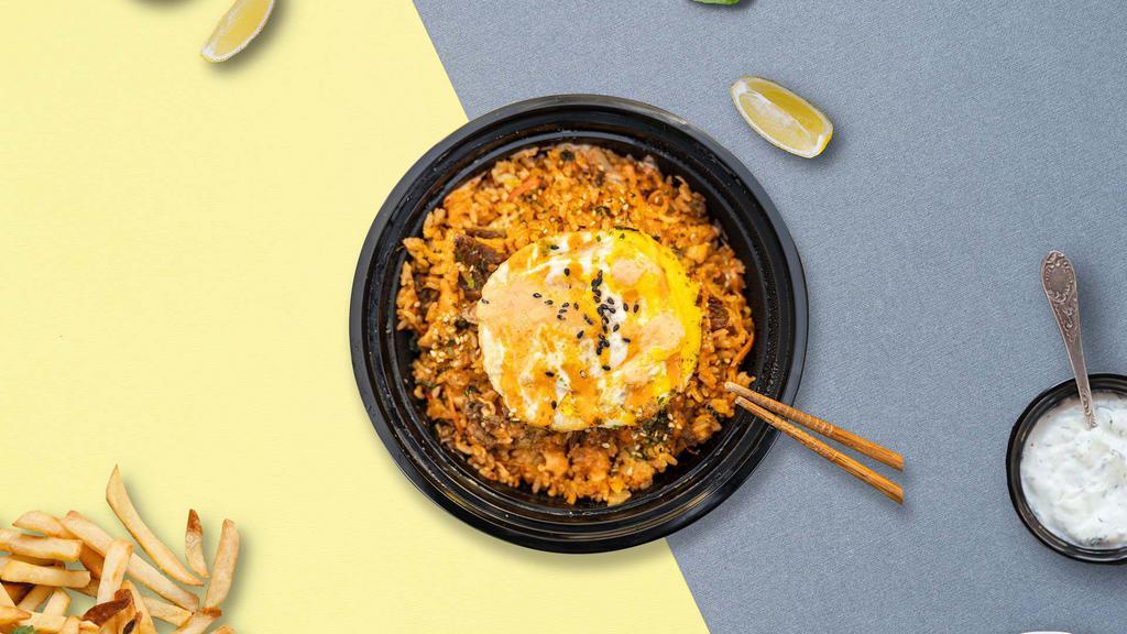 Kimchi Fried Rice · Spicy kimchi fried rice with fried egg over rice.