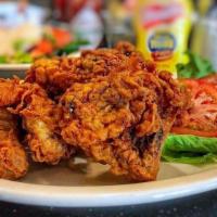 Fried Chicken Tender & Fries · Crispy white meat chicken with BBQ sauce.