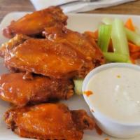 Wings · Crispy fried chicken wings in franks original hot wing sauce. Also available in BBQ sauce.