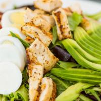 Cobb Salad Grilled Breast Of Chicken · Spring mix, tomatoes, avocado, blue cheese, hard boiled eggs, bacon, with homemade herb vina...