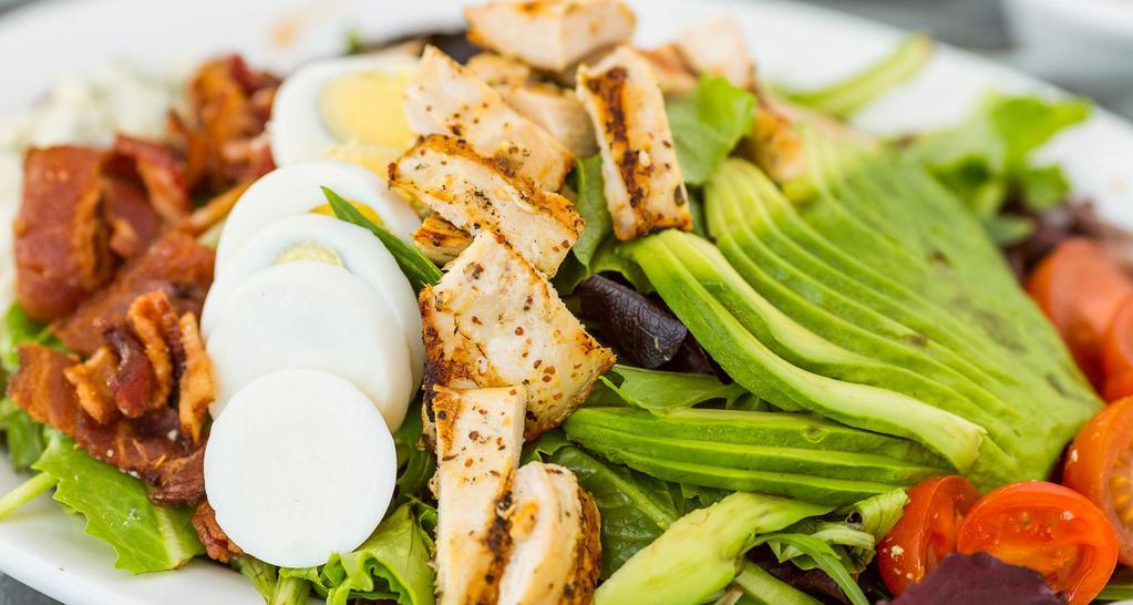 Cobb Salad Grilled Breast Of Chicken · Spring mix, tomatoes, avocado, blue cheese, hard boiled eggs, bacon, with homemade herb vinaigrette dressing.