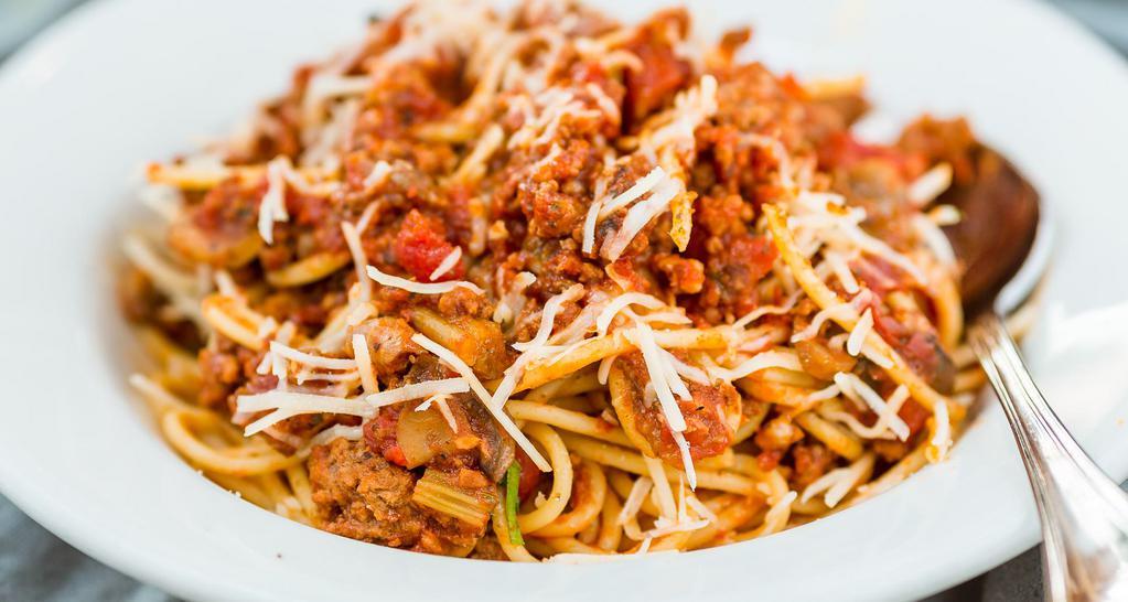 Spaghetti Bolognese · Home made niman ranch meat sauce & parmesan cheese.