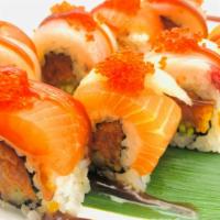 Sekiwake · spicy tuna, cucumber, tempura flake roll topped with salmon, hamachi, tobiko & sesame sauce