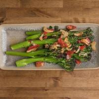 BROCCOLINI · Blanched broccolini, sautéed and roasted in the oven with EVOO and sliced garlic, topped wit...