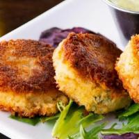 Dungeness Crab Cakes · Three crab cakes served with our homemade pesto aioli.