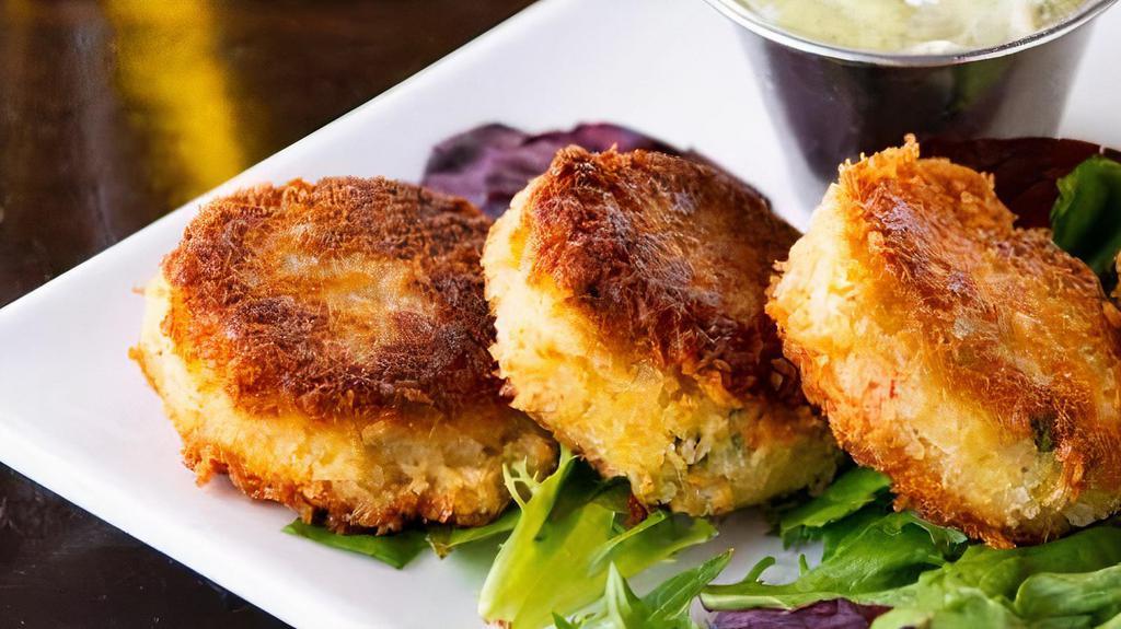Dungeness Crab Cakes · Three crab cakes served with our homemade pesto aioli.