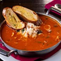 Cioppino · Our signature dish. A bountiful seafood extravaganza of dungeness crab legs, clams, mussels,...