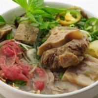 29	House Special Beef Noodle Soup: Rare Steak, Tripe, Flank, Fatty Brisket, Tendon,  And Oxtail · House Dac Biet: Tai, Nam, Gau, Gan, Sach, Duoi Bo, Bo Vien