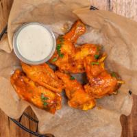 Buffed Buffalo Chicken Wings · Fresh chicken wings breaded, fried until golden brown, and tossed in buffalo sauce. Served w...