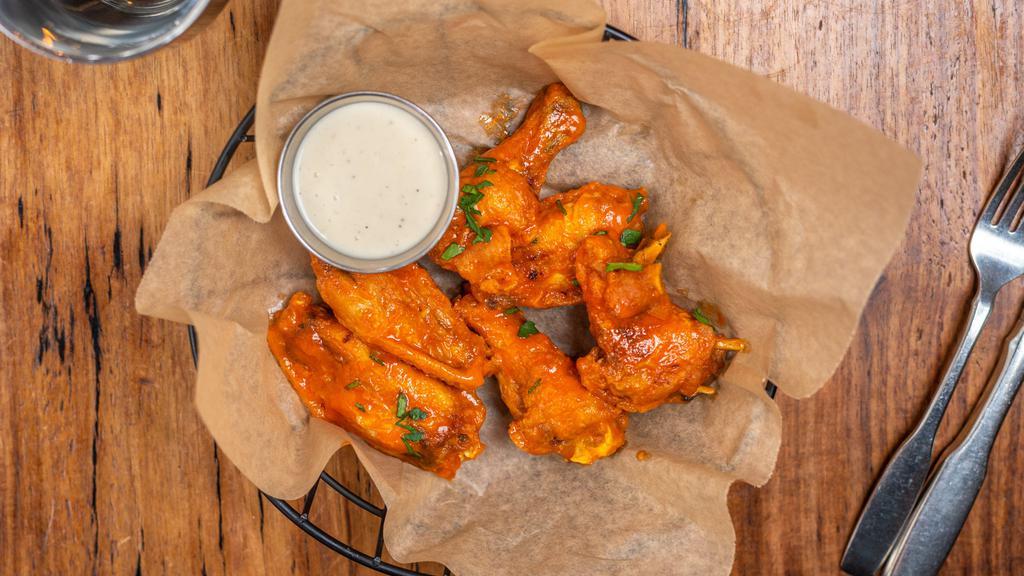 Buffed Buffalo Chicken Wings · Fresh chicken wings breaded, fried until golden brown, and tossed in buffalo sauce. Served with bleu cheese.