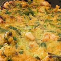 Seafood Pancake / 해물파전 · Korean style pancake with assorted seafood and green onions.
