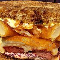 Corned Beef Sandwich · Braised Corn Beef on toasted rye bread , melty Swiss cheese, shaved red cabbage, with whole ...
