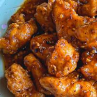 *General Tso's Orange Chicken (左) · Crispy chicken nuggets wok-tossed in a tangy, sweet, and spicy orange sauce. Mildly spicy. A...