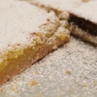 Lemon Bar · Shortbread crust, tangy sweet lemon curd baked to the perfect consistency, topped with powde...