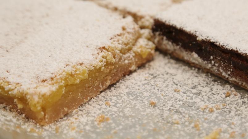 Lemon Bar · Shortbread crust, tangy sweet lemon curd baked to the perfect consistency, topped with powdered sugar.