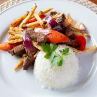 Lomo Saltado (Catering) · Steak strip stir fry with red onion, tomatoes, red bell pepper, cilantro, soy sauce, and pap...