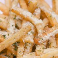 Seasoned Garlic Fries · Seasoning topped on garlic fries.