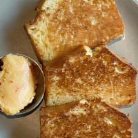 Griddled Cornbread · Calabrian Chili-Honey Butter. (3 Slices)