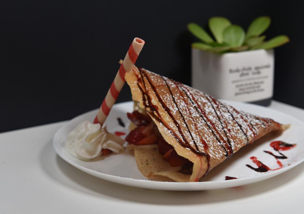 Chocolate Strawberry Crepe · Our Chocolate Strawberry Crepe comes with one crepe  , one scoop of chocolate ice cream, whipped cream fresh cut strawberry chocolate and strawberry syrup.