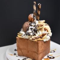 Banana Loco Bread House · Our Banana Loco Bread House comes with one scoop chocolate ice cream, one scoop vanilla ice ...
