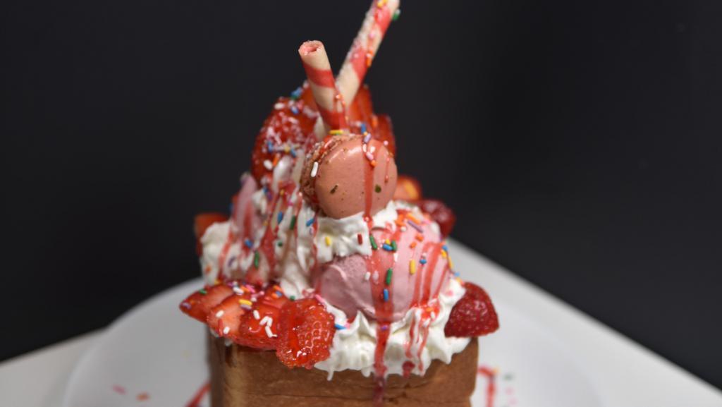 Strawberry Party Bread House · Our Strawberry Party Bread House comes with two scoops strawberry ice cream. Fresh cut strawberry, sprinkle topping and strawberry syrup.