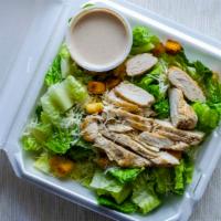Caesar Salad with Chicken · Caesar salad topped with a grilled marinated chicken breast.