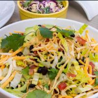 Taco Salad · Romaine hearts, diced tomatoes, black beans, corn, bell peppers, avocado, cheddar cheese, to...