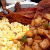 Traditional Breakfast · Your choice of bacon, turkey bacon, pork or turkey, or chicken sausage 
home fries, and scra...
