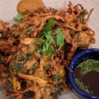 Vegetable Pakora · vegan. gluten-free. Fritters made with seasonal vegetables, served with both mint pesto and ...