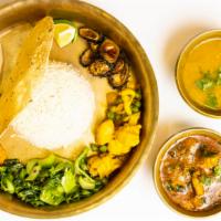 Goat Thakali Thali · Gluten-free. Authentic Nepali platter served with goat, lentil soup, vegetable, rice, papad,...