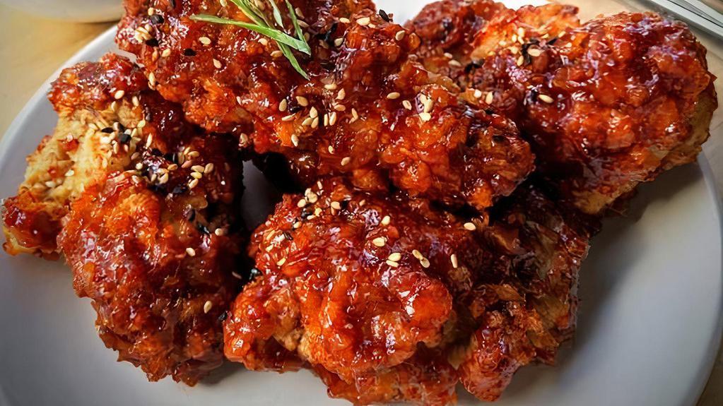 Korean Fried Chicken(5pcs) · 5 pieces fried chicken thigh and drumsticks tossed in spicy Gochujang sauce or soy garlic sauce. Topped with roasted sesame seeds. Comes with a pickled radish.