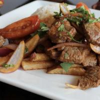 Lomo Saltado · Gluten-free, dairy-free. Beef sirloin steak (USDA), red onions, tomatoes, served with rice, ...