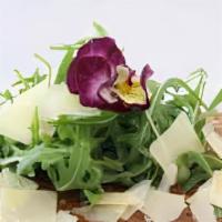 Rocket Salad · organic. arugula tossed fresh squeezed lemon, olive oil and salt; topped with shaved parmesa...