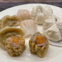 6. Dim Sum Combination Plate · Shrimp dumpling, pork buns, siu mai shanghai small dragon dumplings two each.