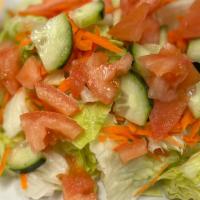 Garden Green Salad · Crispy assorted lettuce, cucumber, carrot and tomato.